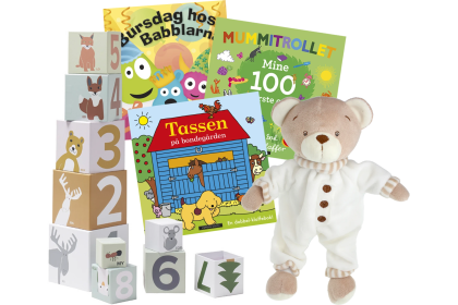 Velkomstgave med stableklosser, bamse og barnebøker